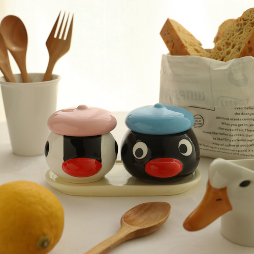 Ceramic spice jar set with oversized cartoon penguin heads