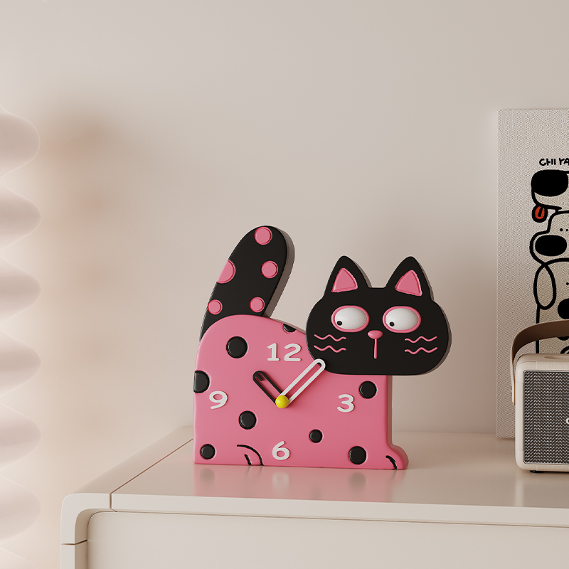 Wide-eyed cat wall clock splashed with bold polka dots