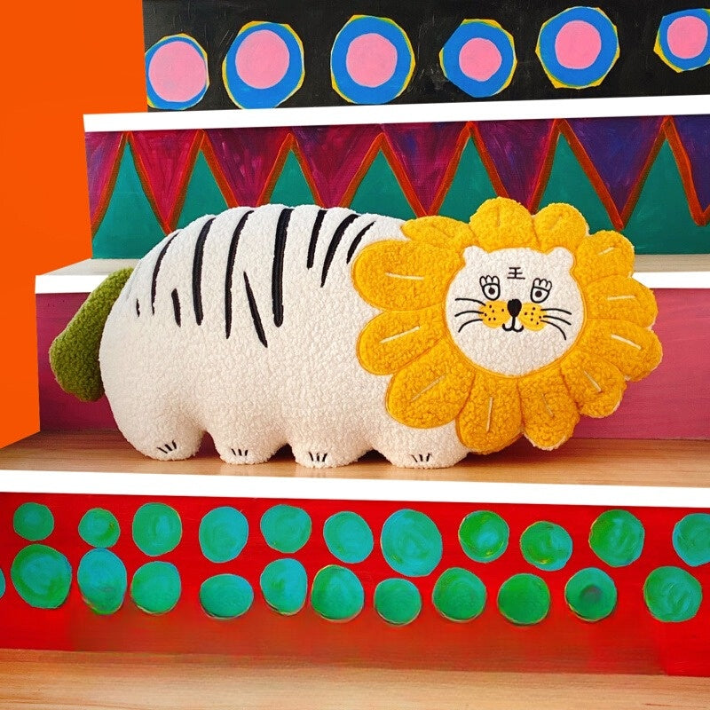 Plush throw pillow shaped like a tiger crowned in a golden lion's mane