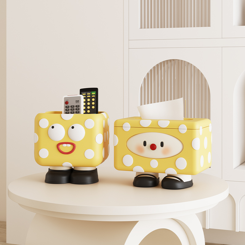 Pair of polka-dot ceramic storage jars with cheerful faces
