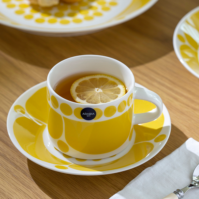 Ceramic tea set with soft curves and sunny polka dots