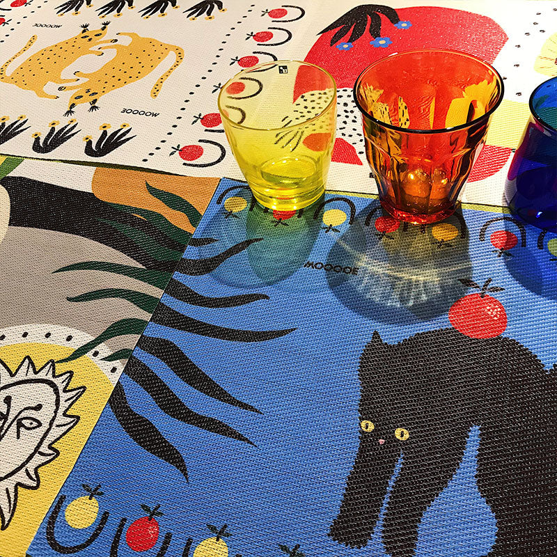 Set of graffiti-print table mats in riotous abstract color
