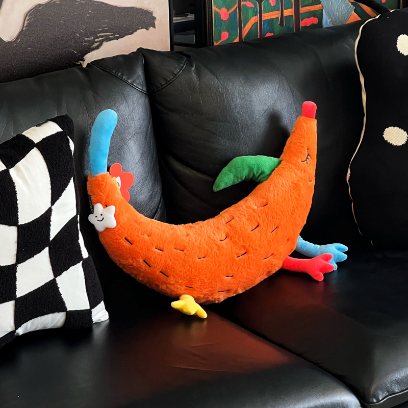 Plush dog cushion in jubilant, painterly color