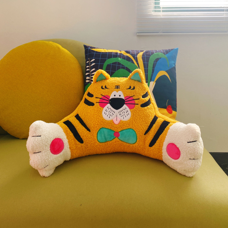 Bold plush tiger cushion, soft as a bedtime secret