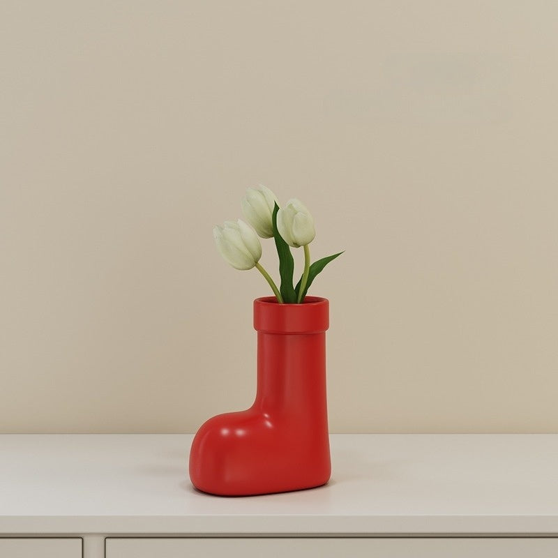 Cherry-red ceramic vase shaped like a little rain boot