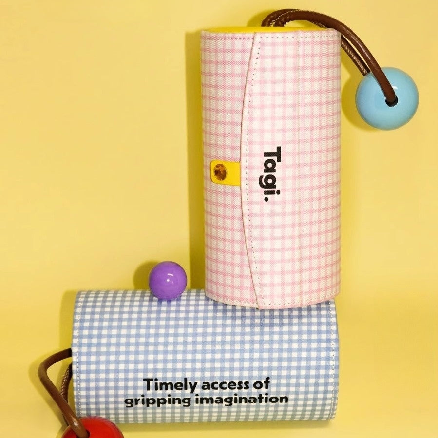 Layered rotating mini jewelry box wrapped in tactile gingham